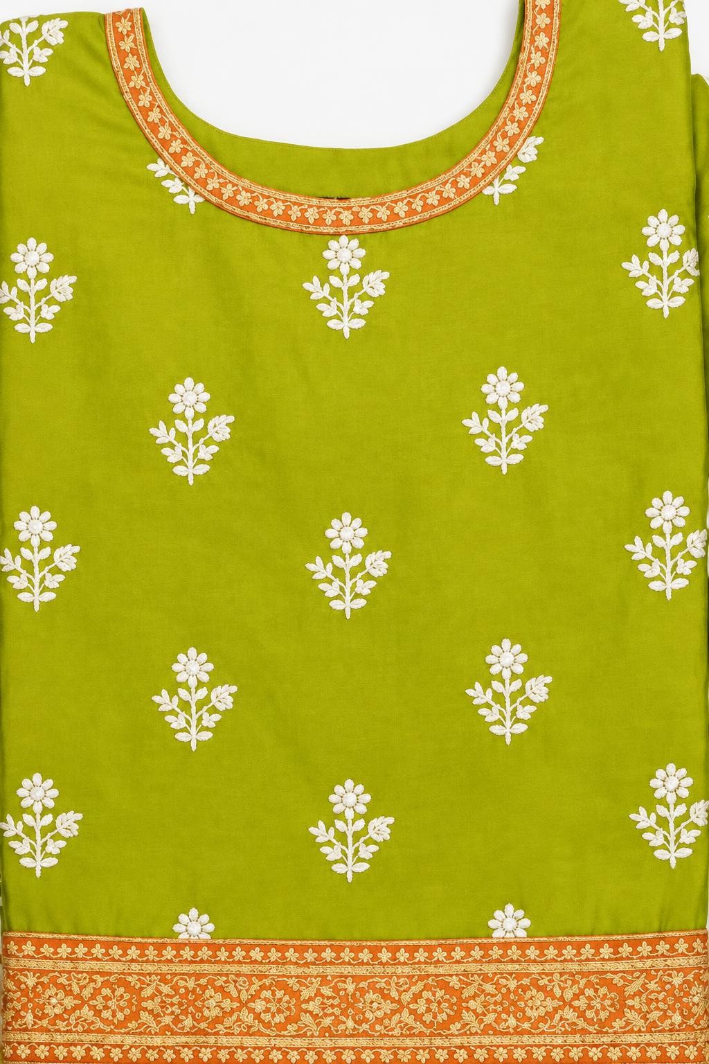 Close-up of the dhani green shirt's white floral buti embroidery and orange neckline