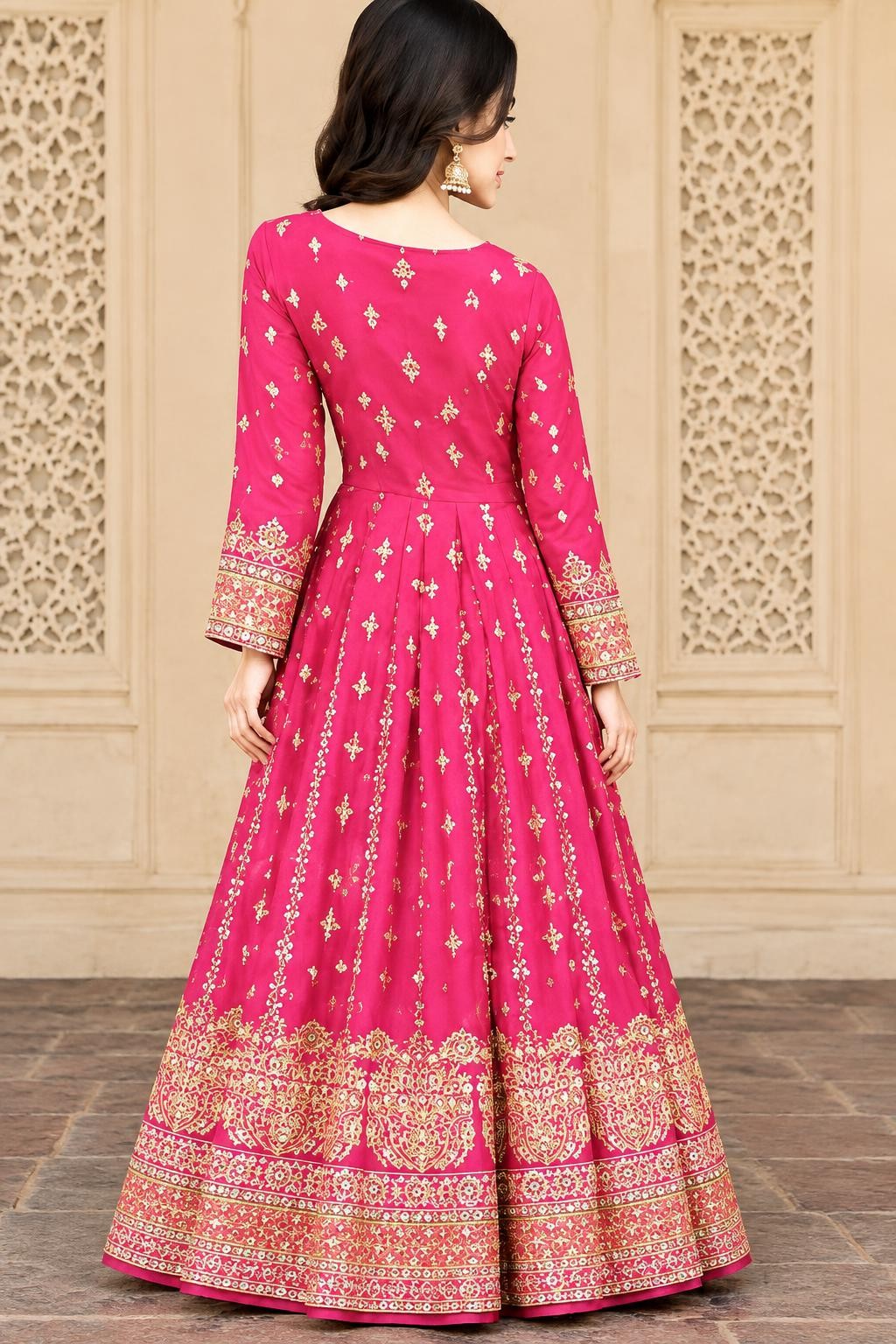 Back view of the pink maxi showing the flared kalis and embroidered hem