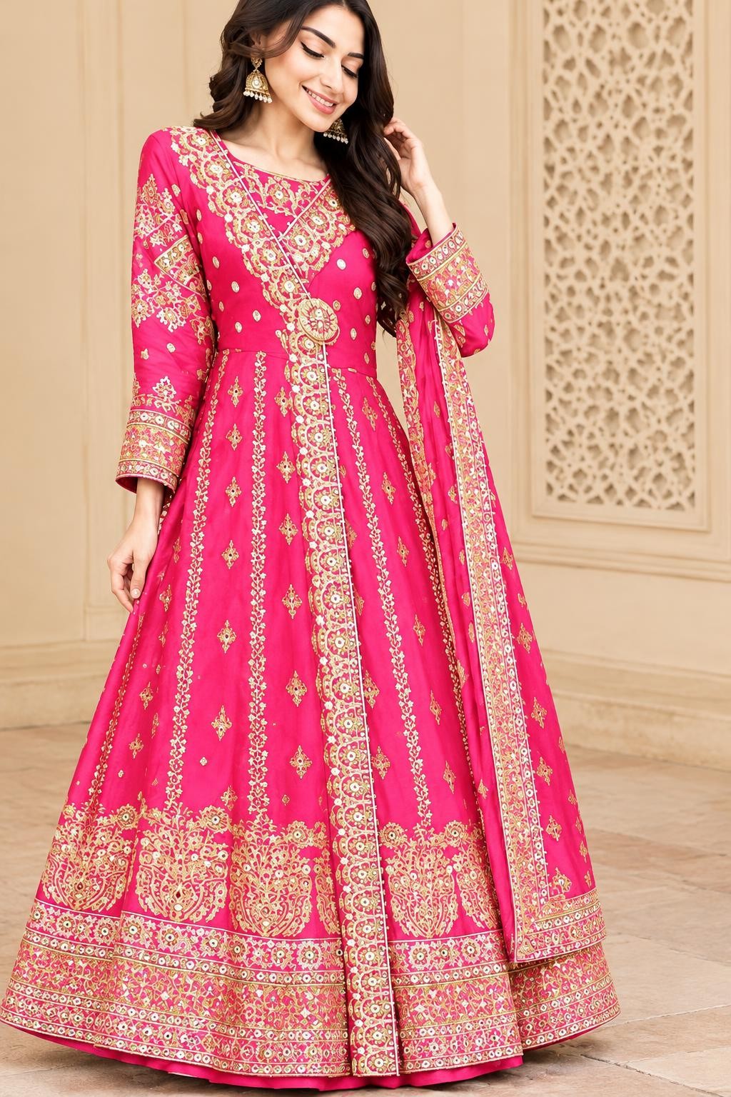Model wearing the pink angrakha maxi with gold embroidery and matching dupatta