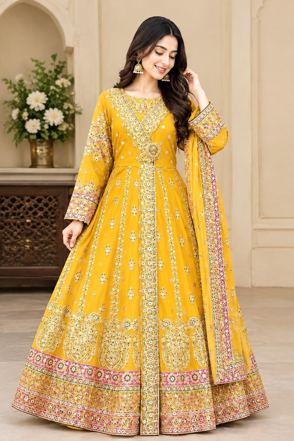 Model wearing the yellow angrakha maxi with gold and multicolour embroidery and dupatta